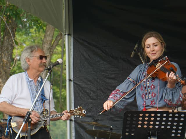 A photo of Ernie Miciak and Rachael Melenka playing on stage